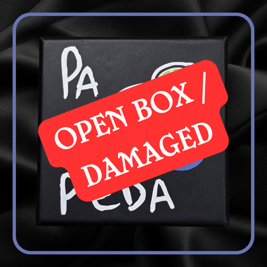Black box with 'Open Box | Damaged' label on a dark background