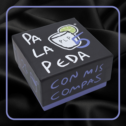 Black box with 'Pa La Peda' text and graphics on a dark fabric background