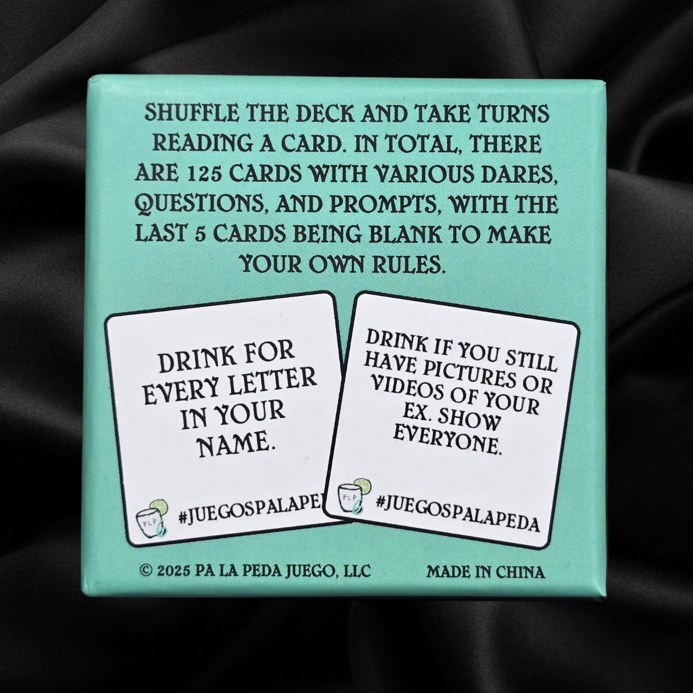 Card game packaging with text and two cards displayed on a black background