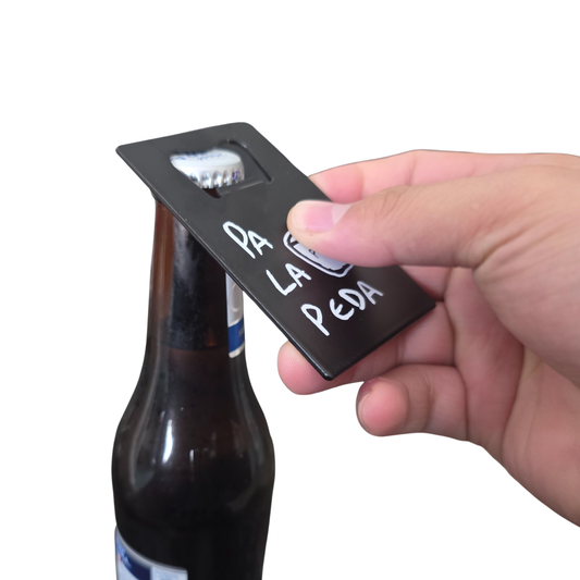 Hand holding a bottle opener with 'Pa La Peda' branding above a bottle.