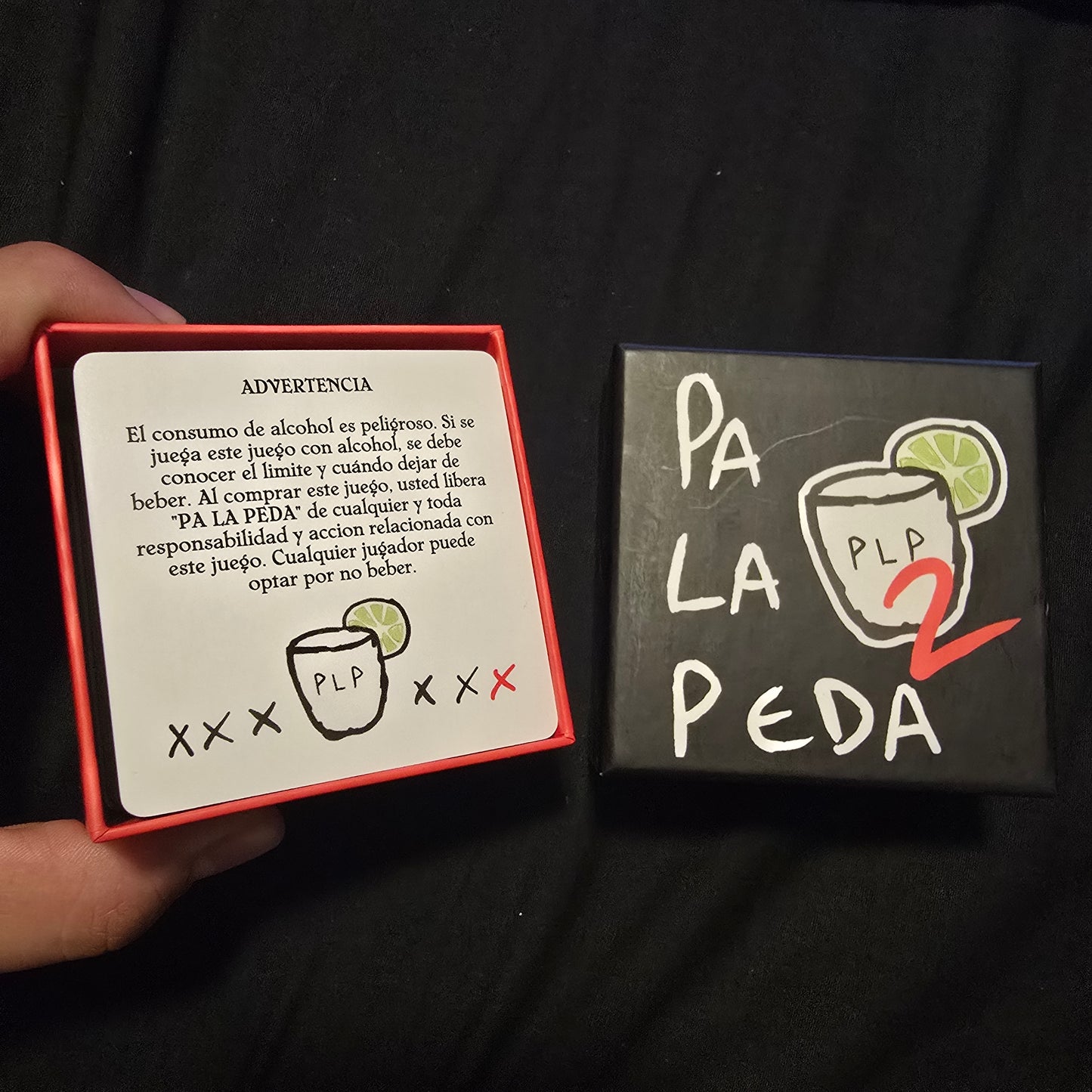 Two boxes with 'Pa La Peda' branding on a black background
