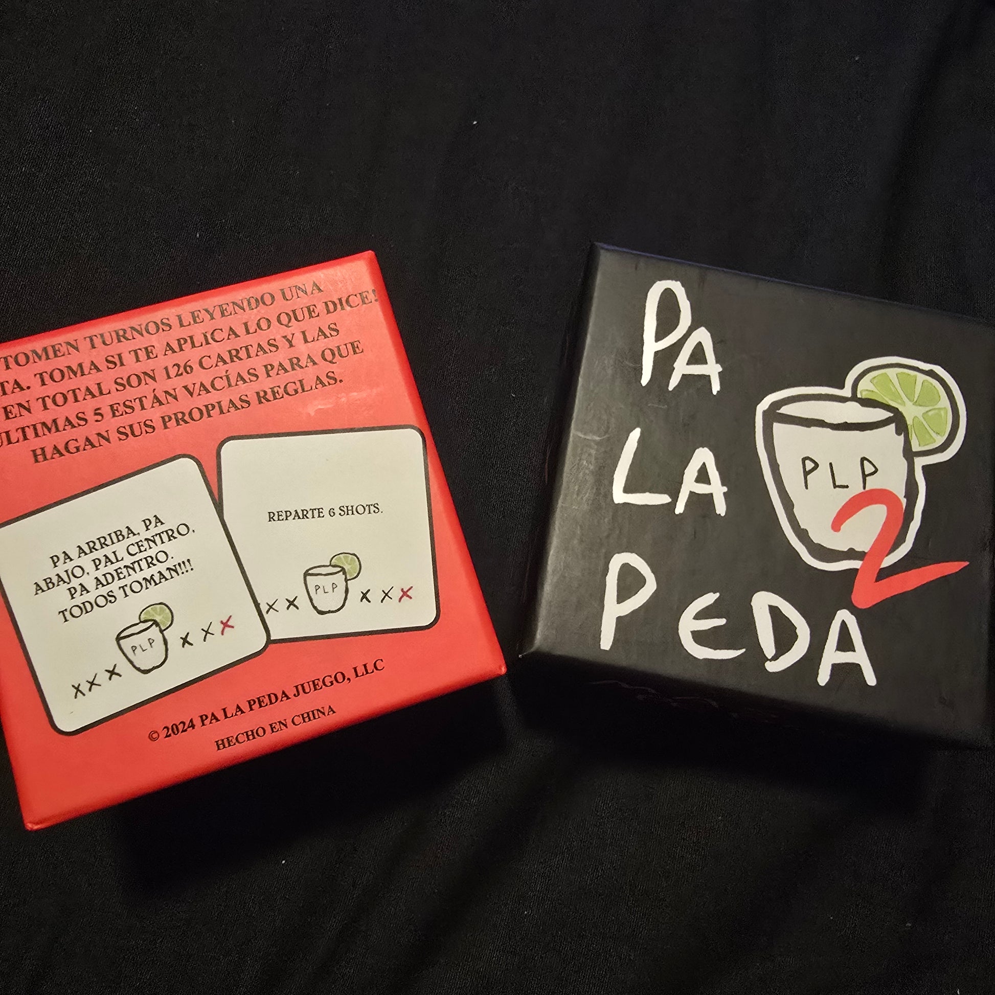 Two boxes with 'Pa La Peda' branding on a black background