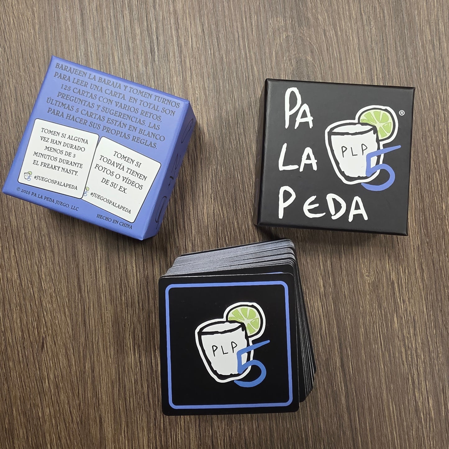 Stack of cards with a logo and text on a wooden surface