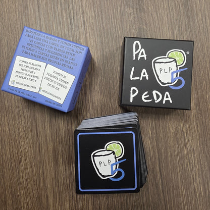 Stack of cards with a logo and text on a wooden surface